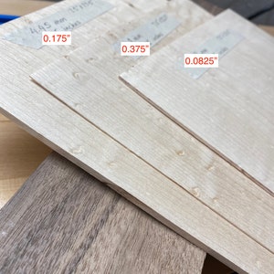 May include: Three pieces of wood veneer, each with a different thickness. The thicknesses are labeled 0.175", 0.375", and 0.0825".