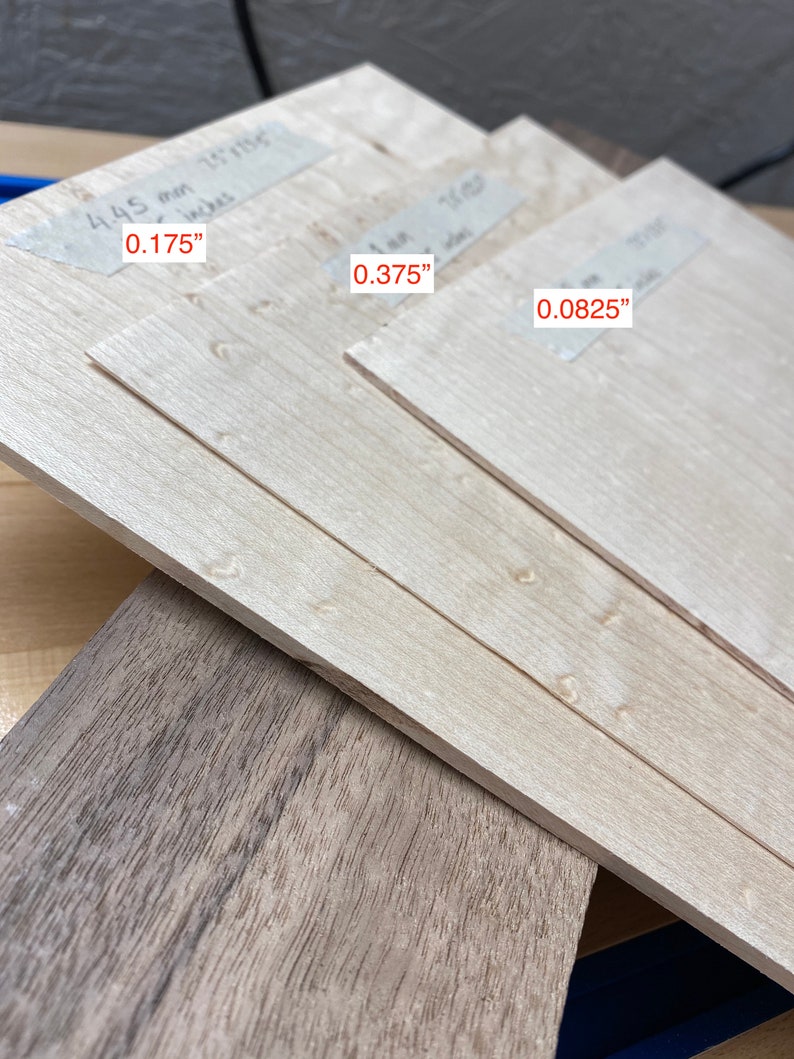 May include: Three pieces of wood veneer, each with a different thickness. The thicknesses are labeled 0.175", 0.375", and 0.0825".