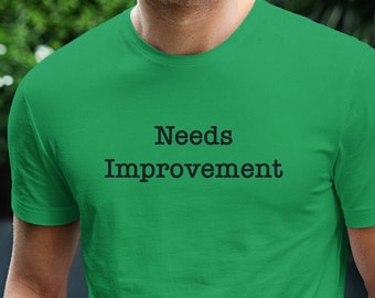 Needs Improvement Funny T-Shirt, Unisex Office Humor T-Shirt, Office Colleague Gift, Office Performance Review Shirt, Corporate Work Shirt