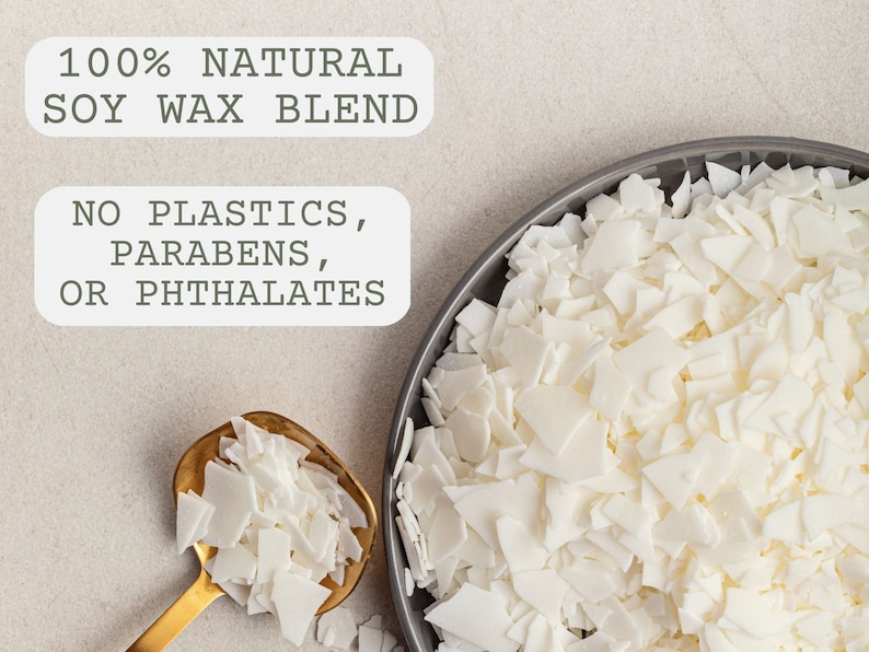 May include: Close-up of white soy wax flakes in a gray bowl and a gold spoon. The text "100% NATURAL SOY WAX BLEND" and "NO PLASTICS, PARABENS, OR PHTHALATES" is visible in the image.