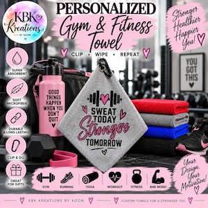 May include: A gray microfiber gym towel with a black carabiner clip, featuring the text 'SWEAT TODAY STRONGER TOMORROW' and a barbell graphic. The towel is displayed alongside a pink water bottle, a black gym bag, and a stack of folded towels.