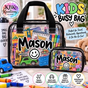 May include: Two clear plastic bags with black trim and handles, personalized with the name Mason and a smiley face graphic. The bags are filled with various colorful toys, crayons, and art supplies, including a green toy car and markers.