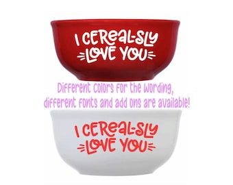 May include: Two ceramic bowls with the text "I CEREAL-SLY =LOVE YOU=" in white and red lettering. The top bowl is red and the bottom bowl is white.