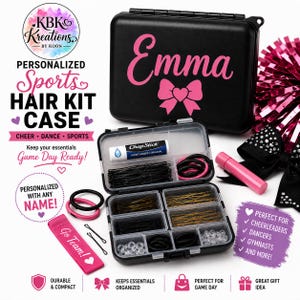 May include: A black rectangular plastic storage case with the name Emma and a pink bow graphic printed on the lid. The open case contains compartments filled with black and gold bobby pins, black hair ties, clear hair elastics, and a ChapStick.