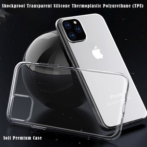 May include: A clear, transparent phone case made of silicone thermoplastic polyurethane (TPU). The case is designed to protect a smartphone from shocks and drops. The case is shown on top of a silver smartphone with a black background. The case is labeled "Soft Premium Case".