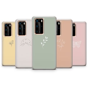 May include: Five phone cases with different minimalist designs. The cases are all clear and have a white design on them. The designs include a mountain range, a flower, a butterfly, a branch with leaves, and a branch with flowers.