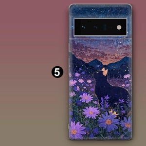 May include: A black cat sits in a field of purple flowers, looking up at a starry night sky. The phone case features a galaxy design with a sunset in the background.