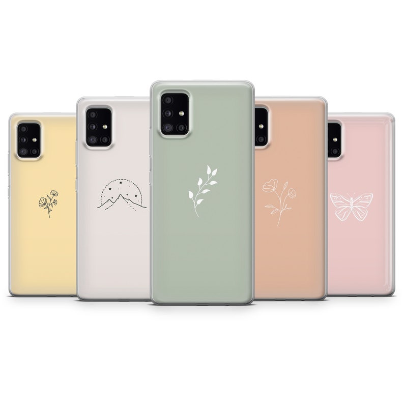 May include: Five different phone cases with various minimalist designs. The cases are all clear and have a white design on them. The designs include a mountain range, a butterfly, a flower, a branch with leaves, and a flower with a stem.