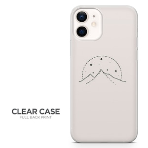 May include: A clear phone case with a full back print of a mountain range with stars in a circle around it.