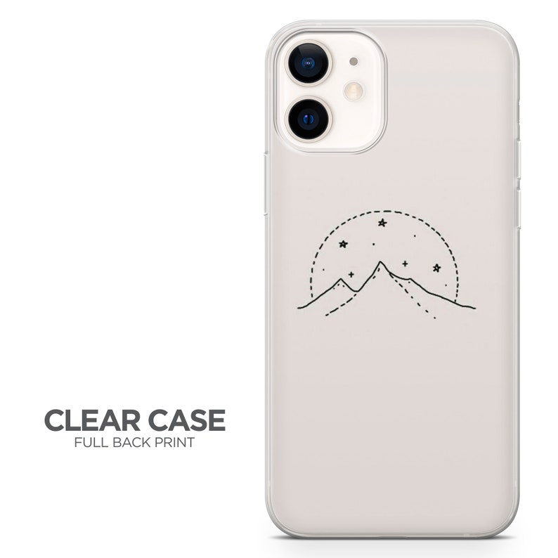 May include: A clear phone case with a full back print of a mountain range with stars in a circle around it.