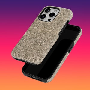 May include: A beige phone case with a floral pattern and a black phone case with a black screen. The phone case is designed for an iPhone.