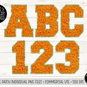 May include: Orange felt letters and numbers with gold glitter trim. The letters spell out "ABC" and the numbers are "123".