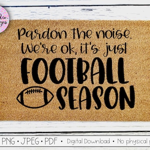 May include: A brown doormat with the text "Pardon the noise. We're ok, it's just FOOTBALL SEASON" in black lettering. A black and white football graphic is to the left of the word "SEASON".