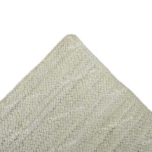 May include: A close-up of a light gray textured fabric with a subtle pattern. The fabric is folded into a triangle shape.
