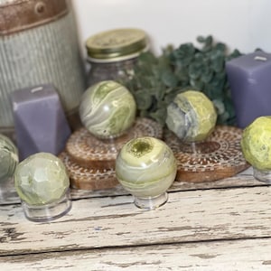 Polished & Faceted Serpentine Sphere Lot – Set of 7 Green Crystal Balls with Display Stands | Wholesale Clearance