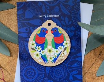 Tarjeta de decoración navideña de loritos arcoíris