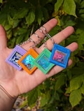Custom Pokemon Gameboy Cartridge keychains - resin capped product logo