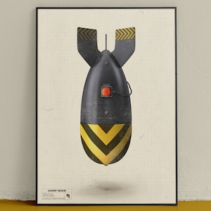 May include: Framed print of a black bomb illustration with yellow and black chevron stripes. The bomb has a red button and the text "WARP NUKE" at the bottom, set against a grid background.