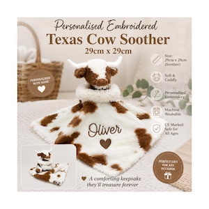 May include: A plush cow soother featuring a white and brown spotted pattern with a soft texture. The center is embroidered with the name Oliver and a small brown heart. The item measures 29cm by 29cm and includes a small plush cow head.
