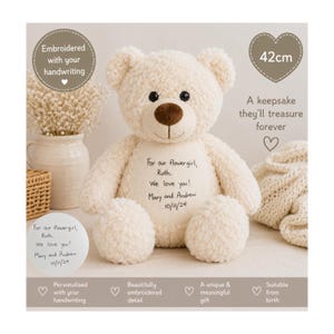 May include: A cream-coloured plush teddy bear with a brown nose and dark eyes. The bear features custom embroidery on its chest that reads: For our flowergirl, Ruth. We love you! Mary and Andrew 10/11/24. The bear is labelled as 42cm in height.