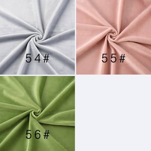 May include: Three swatches of velvet fabric arranged in a grid. The top left is light gray labeled 54#, the top right is dusty pink labeled 55#, and the bottom left is olive green labeled 56#. Each fabric piece features soft folds and a smooth texture.