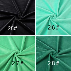 May include: A four-panel grid showing velvet fabric in different colors. Top left is black labeled 25#, top right is mint green labeled 26#, bottom left is bright green labeled 27#, and bottom right is dark forest green labeled 28#.