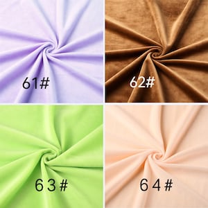May include: A four-quadrant display of soft fabric swatches. Top left is light purple labeled 61#. Top right is brown labeled 62#. Bottom left is lime green labeled 63#. Bottom right is pale peach labeled 64#. Each fabric features a central swirl.