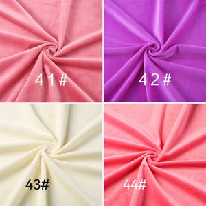 May include: A grid of four velvet fabric swatches in pink, purple, cream, and coral. Each swatch is gathered in the center to show texture and drape. The swatches are labeled with white text as 41#, 42#, 43#, and 44# respectively.