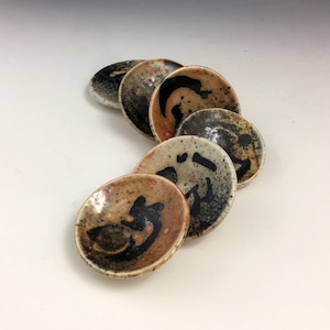 Woodfired miniature saucers, fired to 2400 degrees, made to last, functional, fun, and beautiful, 2-3 inches wide, 1.5 ounces, 1 inch tall