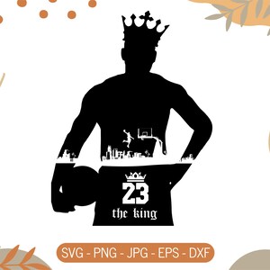 May include: Black silhouette of a person wearing a crown, holding a basketball. The design includes a cityscape and the text "23 the king". The image is a vector graphic, with file formats listed at the bottom.