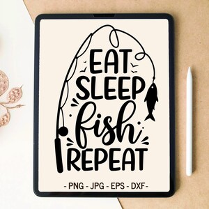 May include: A digital illustration on a tablet with the words "EAT SLEEP FISH REPEAT" in a black, stylized font, with a fishing rod and fish graphic. The tablet is black, and a white stylus is next to it.