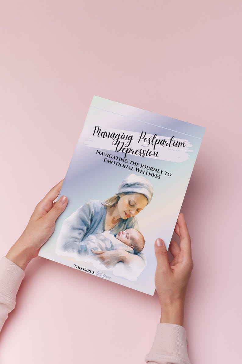 May include: A book titled "Managing Postpartum Depression" is held by hands against a pink background. The cover features a watercolor illustration of a mother holding a baby. The text reads "Navigating the Journey to Emotional Wellness."