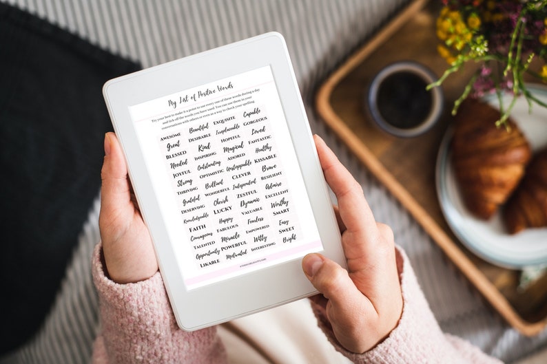May include: A white tablet screen displaying a list of positive words in black cursive font. The list is titled "My List of Positive Words".