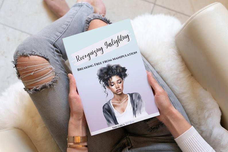 May include: A person is holding a book titled "Recognizing Gaslighting: Breaking Free From Manipulation" with a watercolour illustration of a woman with dark hair on the cover.