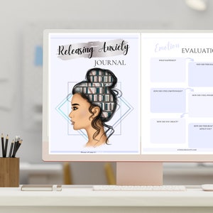 May include: A computer screen displaying a printable journal page with the title "Releasing Anxiety Journal" and a graphic of a woman with books in her hair. The right side of the screen shows a section titled "Emotion Evaluation" with a table for journaling.