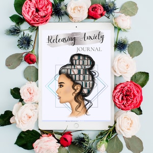 May include: A white tablet with a digital illustration of a woman with a bookshelf inside her head. The text "Releasing Anxiety JOURNAL" is on the tablet. The tablet is surrounded by pink and red roses.