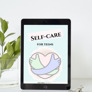 May include: A digital tablet displaying a self-care guide for teens. The guide features a pink heart with two hands embracing it, one green and one blue. The text "SELF-CARE FOR TEENS" is displayed in black text on a light blue background. The bottom of the screen reads "THIS GIRL'S Got Game".
