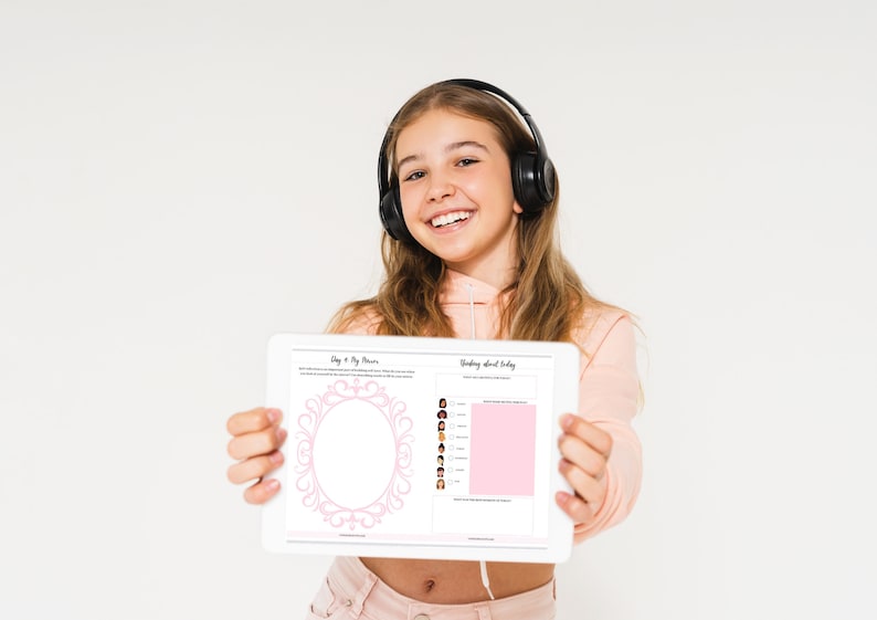 May include: A young person wearing headphones holds a tablet displaying a pink and white printable planner with the text "Day & My Plans" and "Thinking about today".
