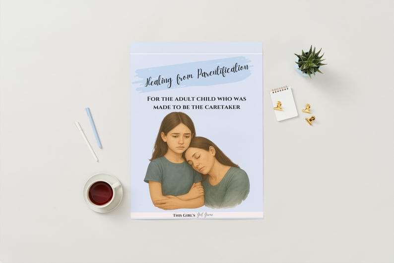 May include: A notepad with the title "Healing from Parentification" and the text "For the adult child who was made to be the caretaker." The illustration shows two women in teal shirts. A cup of coffee, pens, and stationery are also visible.
