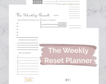 May include: A white weekly planner with sections for self-care, goals, and meal planning. The title "The Weekly Reset Planner" is in a pink watercolor-style banner. The planner includes the text "Organize the chaos, keep the joy!"