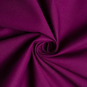 May include: A close-up of a deep purple fabric with a soft, smooth texture. The fabric is folded and draped, creating a swirling pattern.