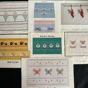 May include: A collection of embroidery patterns for baby items. The patterns include ice cream cones, kid cycles, stocking stuffers, Sarah's sheep, and Edith's butterfly. The patterns are printed on white paper with a light blue border.