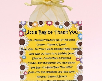 May include: A small yellow bag with a white drawstring, filled with small gifts. A card attached to the bag reads "Little Bag of Thank You" with a list of items and thank you messages. The card has a yellow background with a daisy pattern.