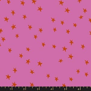 May include: A fabric with a pink background and scattered orange star shapes. The text "RUBY STAR SOCIETY" is printed along the bottom edge of the fabric.