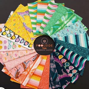 May include: A circular arrangement of colorful fabric squares with various patterns, including sunglasses, tigers, and geometric designs. The color palette includes yellow, pink, green, and blue. The text "Poolside Too Collaborative Collection" is in the center.