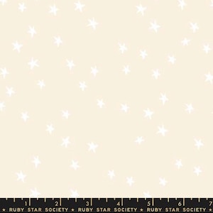 May include: Pale cream fabric featuring a random arrangement of white star shapes. The material has a soft, non-glossy appearance. The text "RUBY STAR SOCIETY" is printed along the bottom edge.