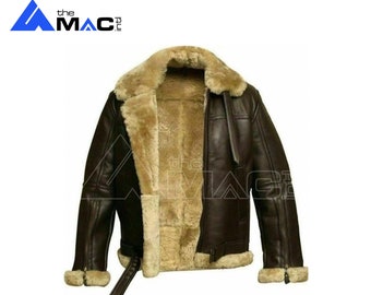 May include: A brown leather jacket with a shearling lining. The jacket has a zipper closure, two pockets, and a belt.
