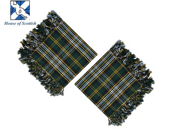 May include: Two square green, yellow, and white plaid scarves with fringed edges. The scarves are arranged diagonally against a white background. The words "House of Scottish" are printed in black text above the scarves.