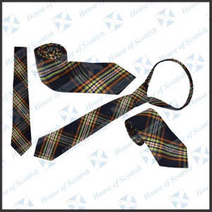 May include: Three black and orange plaid ties with yellow and white accents. The ties are arranged to show the different ways they can be worn.