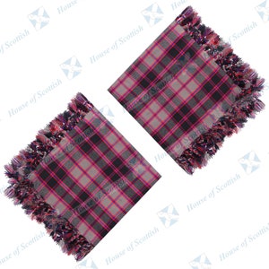 May include: Two square items with a tartan pattern in black, grey, and pink, finished with a colourful fringe. The fringe is a mix of red, purple, and blue. The words "House of Scottish" are printed on the items.